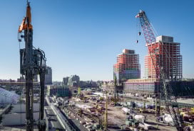 Construction site with new apartment buildings and cranes in Gowanus, Brooklyn, NY