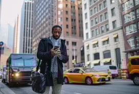 Man looking at his phone in NYC street