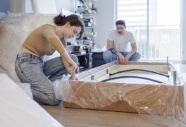 couple assembling a couch