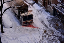plow digs out a West Village street after a blizzard in 2016