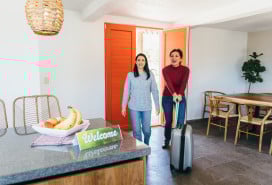 Travelers arriving at new rental apartment