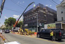 Construction work with a crane on new building in the Bronx NY