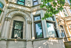 New windows in a marble stone style with bay windows and ornate trim