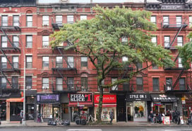 Manhattan apartment buildings with stores on the ground level