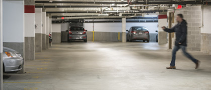 Man Rushing To Car In Parking Garage