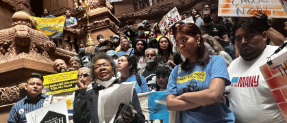 Tenant reform advocates with banners calling for good cause eviction laws in Albany