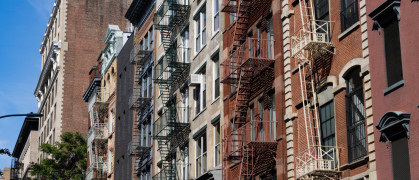 Residential Buildings with Fire Escapes along a Street in SoHo of New York City