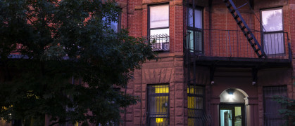 Red brick apartment building in Park Slope in the evening
