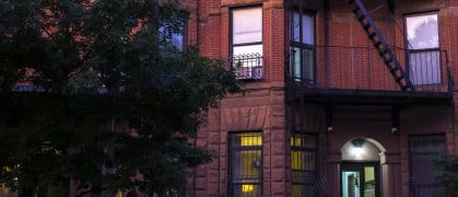 Red brick apartment building in Park Slope in the evening