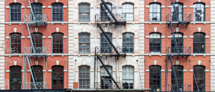 Exterior view of historic brick buildings along Duane Street in the Tribeca neighborhood of New York City NYC