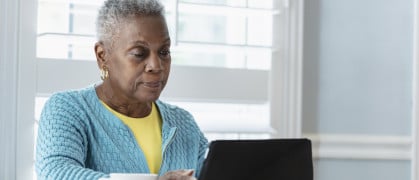 Black woman using digital tablet