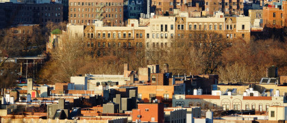 Buildings peek out above trees in Inwood, Manhattan.