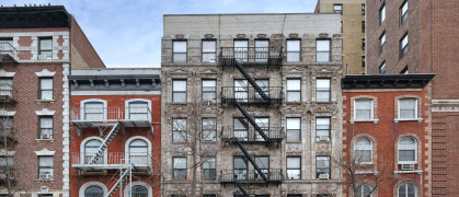 NYC apartment buildings with fire escapes