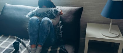 Distressed woman sitting in her apartment