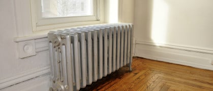 cast iron radiator next to a window