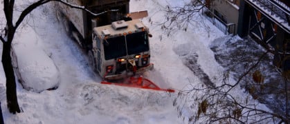 plow digs out a West Village street after a blizzard in 2016