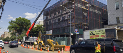 Construction work with a crane on new building in the Bronx NY