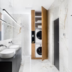 stacked washer/dryer condo in a bathroom