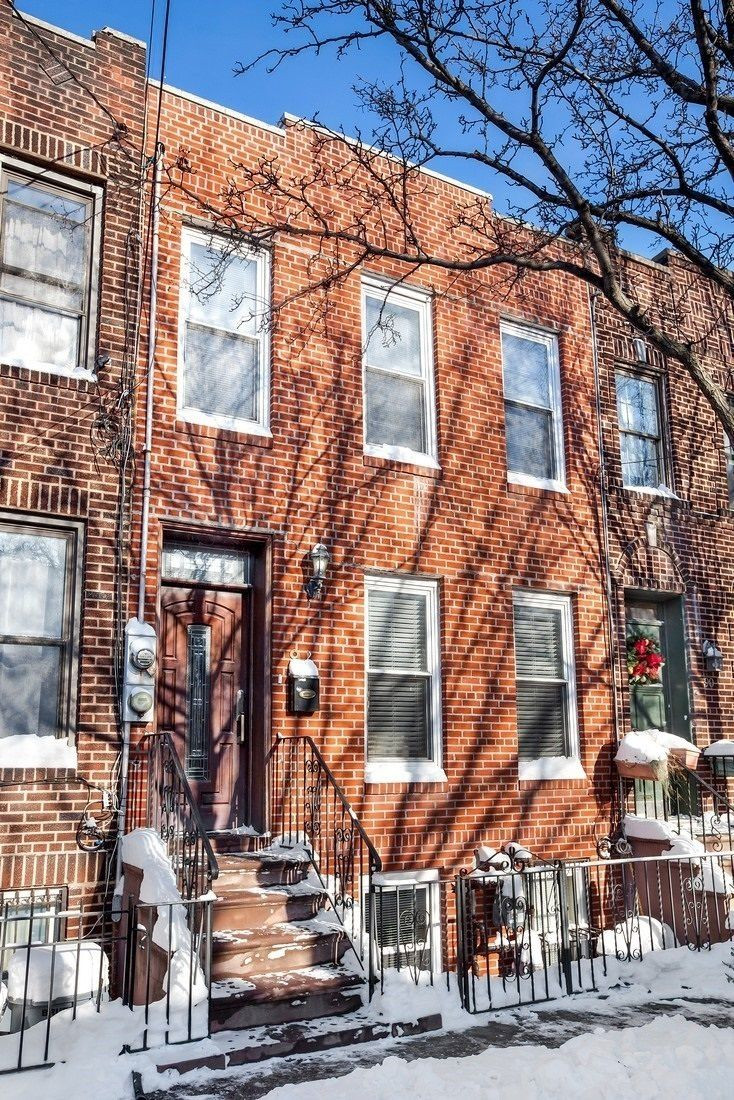 Live on a cute block in Red Hook and collect rental in this twofamily townhouse