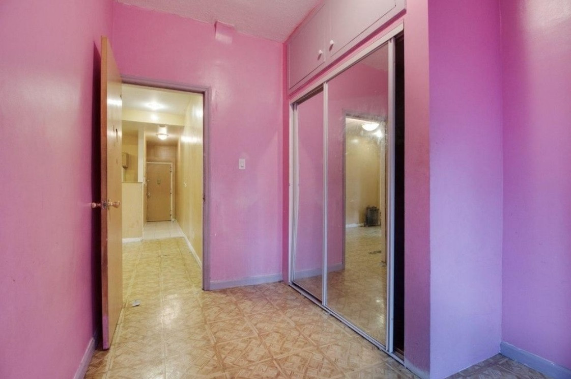 A lot of TLC needed to transform this outdated Sunset Park two bedroom