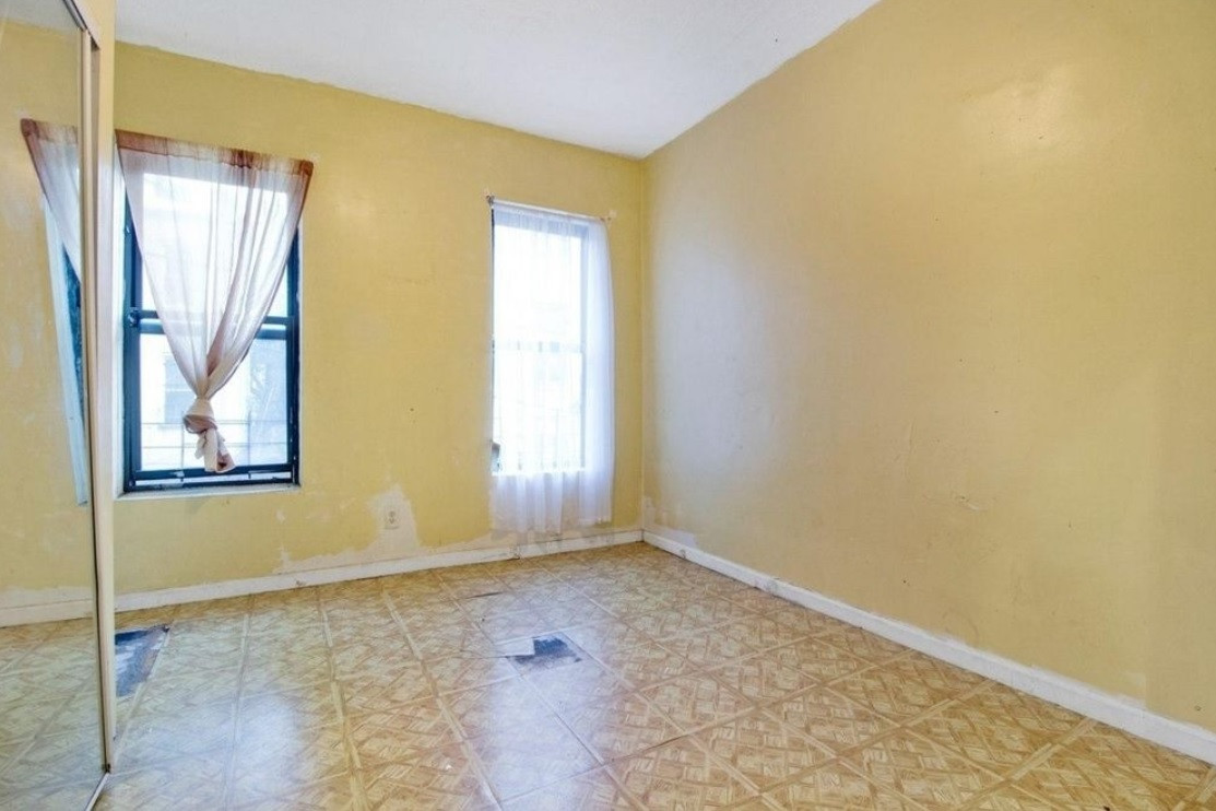 A lot of TLC needed to transform this outdated Sunset Park two bedroom