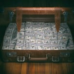 iStock-suticase full of money.jpg image